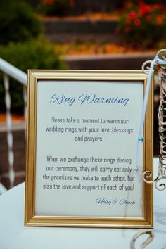 a framed sign sitting on top of a white table