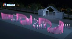 a group of pink candles sitting on top of a sidewalk