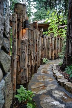 a path made out of logs leads to a house