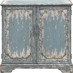 an old blue cabinet with peeling paint on the doors and bottom part of it's door