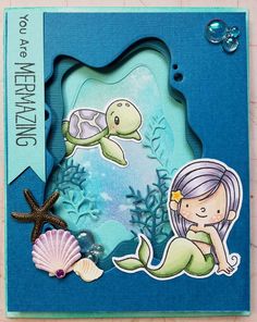 a card with an image of a mermaid and sea turtle on it's side