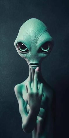 an alien is holding his hand up to the camera and making a gesture with it's face