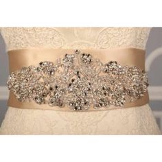 This Gorgeous B525 Embellished Bridal Sash Is Brand New And Ready To Wear! The Champagne Embellished Sash Belt Is A Perfect Accessory For Your Wedding Gown, Bridesmaid Dress, Or Formal Attire! The Sash Features Gorgeous Crystal Beadwork And Embroidery. It Has Just The Right Amount Of Sparkle For Your Special Day! Original Retail Price: $710.00 Fabric: Champagne Swiss Double Faced Satin Size: 3 31/2″ Wide By 3 Yards Long Details: Crystal Beadwork And Embroidery * The Gown In The Photos With This Elegant Silver Bedazzled Sash, Elegant Bedazzled Silver Sash, Elegant Silver Bedazzled Sashes, Elegant Bedazzled Silver Sashes, Elegant Bedazzled Wedding Sash, Embellished Silver Bridal Belt, Silver Embellished Bridal Belt, Elegant Silver Embellished Bridal Belt, Silver Bedazzled Bridal Belt For Wedding