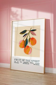 a framed poster with fruit of the spirit on it in front of a pink wall