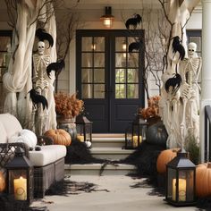 a porch decorated for halloween with skeletons and pumpkins