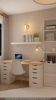 a computer desk with a laptop on it in front of a window and bookshelf