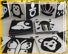 a bunch of black and white paper with animals on them, some are cut out