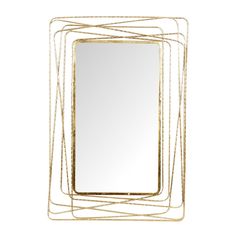 a gold metal frame mirror sitting on top of a white wall