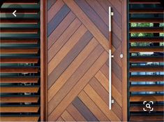 a close up of a wooden door with slats