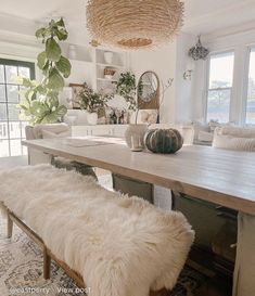 a dining room table with two benches in front of it