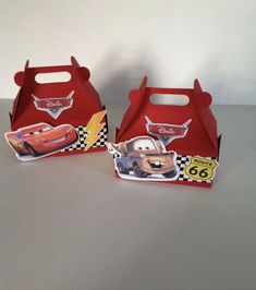 two red boxes that have cars on them