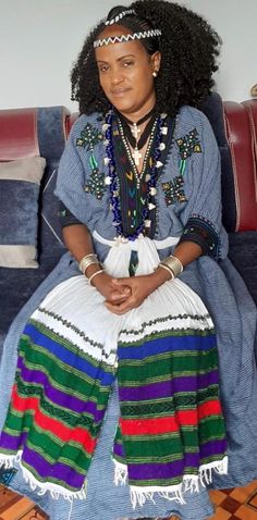 This is a beautiful authentic Ethiopian dress is straight from the Sekota, Wollo area of the Amhara region. It is made from organic cotton and features cultural colourful embroidery which is called "tilf" in Amharic. It is free size and can fit most people. It comes with a beautiful colorful waist scarf which is called "Mekenet" in Amharic. Traditional Kaftan With Multicolor Embroidery And Patterns, Traditional Multicolor Kaftan For Ceremonies, Traditional Multicolor Kaftan With Embroidered Border, Traditional Embroidered Kaftan With Traditional Patterns, Traditional Kaftan With Multicolor Embroidery, Folk Style Habesha Kemis For Festivals, Traditional Multicolor Habesha Kemis For Ceremonies, Multicolor Habesha Kemis With Traditional Patterns, Multicolor Folk Habesha Kemis For Festivals