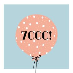 a pink balloon with the word 7000 on it's side and polka dots