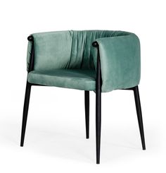 a green velvet chair with black legs and armrests on an isolated white background