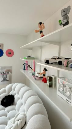 there are many toys on the shelves in this room