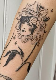 a woman's arm with a tattoo on it