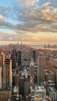 an aerial view of new york city at sunset