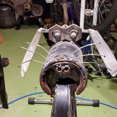 an old bicycle is being worked on in a shop