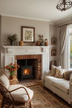 a living room filled with furniture and a fire place next to a large open window