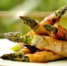 asparagus, carrots and other vegetables on a white plate