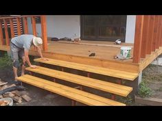 a man is working on some wooden steps