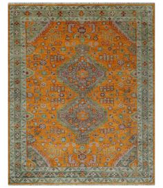 an orange and green rug with many different designs on it's sides, including the center