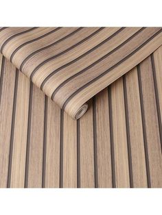 a close up view of a wooden surface with vertical stripes on the top and bottom