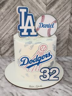 a birthday cake decorated with the los angeles dodgers logo