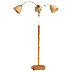 a wooden floor lamp with two lamps on it