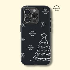 an iphone case with a christmas tree on it and snowflakes in the background