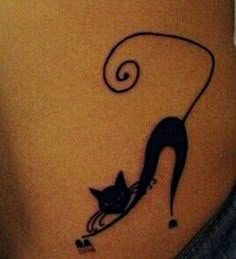 a woman's stomach with a cat tattoo on her belly and an ink pen in the shape of a shoe