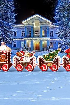 A festive holiday train decoration in front of a mansion adorned with Christmas lights and surrounded by snow-covered trees. Gingerbread Santa, Outdoor Christmas Decorations Yard, Train Decor, Santa Claus Decorations, Christmas Tree And Santa, Yard Decorations, Lawn Sign, Led Christmas Lights