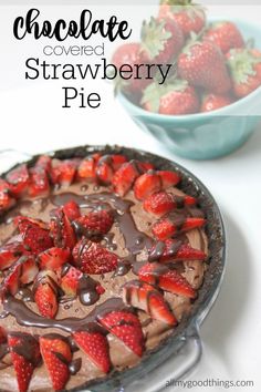 chocolate covered strawberry pie on a plate with strawberries in the bowl behind it and text overlay reading chocolate covered strawberry pie