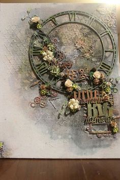 an altered photograph of a clock with flowers and words on the face, sitting on top of a wooden table