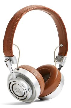 the headphones are brown and white with silver trimmings on each earpiece