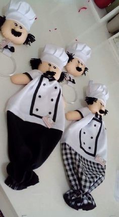 three stuffed chefs are sitting on the counter