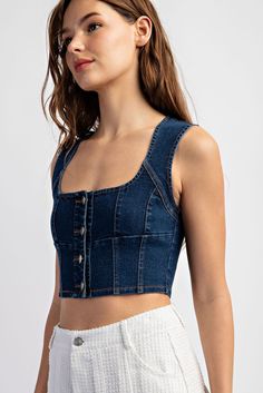 Unleash your inner fashionista with our Karlee Denim Crop Top. Made with stretch denim, this sleeveless button-front top is a stylish statement piece that effortlessly hugs your curves. Perfect for pairing with high-waisted skirts or jeans. You'll be turning heads wherever you go! Neckline: Square Neck Length: Cropped Sleeve length: Sleeveless Sleeve type: None Stretch: Slightly Stretchy Features: Button Up Front Sheer: No Care instructions: Machine wash cold. Tumble dry low. Product measurement Chic Cheap Washed Blue Denim Top, Cheap Cropped Medium Wash Denim Top, Casual Medium Wash Denim Top, Cheap Blue Relaxed Fit Denim Top, Cheap Denim Blue Casual Crop Top, Affordable Trendy Denim Blue Top, Cheap Dark Wash Denim Crop Top, Chic Cheap Medium Wash Denim Top, Cheap Chic Washed Blue Denim Top