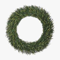 a wreath with green leaves is shown against a white background and has no shadow on it