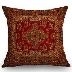 a red and gold pillow with an ornate design