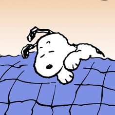 a cartoon dog laying on top of a blue blanket