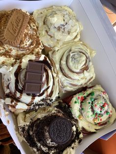 a box filled with different types of desserts