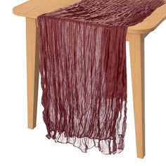 a table with a red scarf on top of it