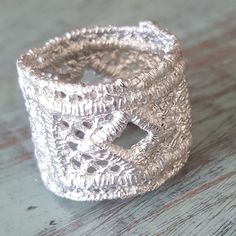 Silver Lace Ring Wedding Band Lacey Ring We take a beautiful piece of lace and cast it directly to make this one of a kind ring. This listing is for 1 ring only, the first one in the listing. This ring was made from a piece of lace that had a little geometric design,which is what we cast in our studio using the method of lost wax casting. You can see all the threads in the lace. It is so cool! This ring is almost 1/2 ounce of the best sterling silver. It is a one of a kind and only available in Africa Necklace, Peace Sign Necklace, Thick Ring, Lace Ring, Dog Pendant, Ring Wedding Band, Silver Lace, Wax Casting, Lost Wax Casting