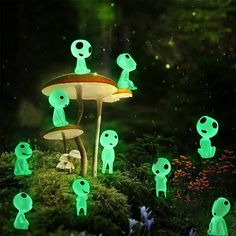 an image of green glowing mushrooms in the forest with butterflies flying around them and one mushroom is surrounded by small, light - up figures