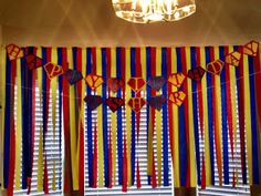 the room is decorated with colorful streamers and decorations