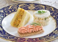 three different types of food on a blue and white plate with gold trimmings