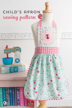 a child's apron sewing pattern on a mannequin with books in the background