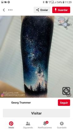 an image of a person's arm with a sky and stars tattoo on it