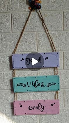 a wooden sign hanging on the side of a brick wall that says, go vibes only