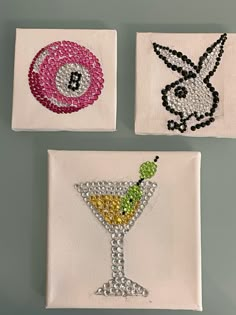 three coasters with different designs on them, one has a martini and the other has a bunny